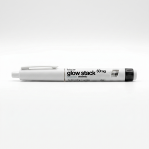Close-up of a white peptide pen lying on a light surface, showing printed text like 'glow stack' and '60mg'.